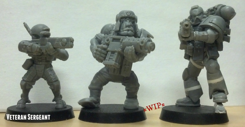 converted ork boy and Tau Fire Warrior models next to True Scale Space Marine for scale