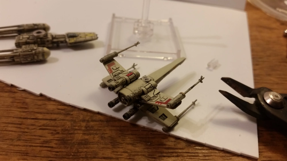 clipping post off X-Wing miniature with sprue cutters plastic clippers